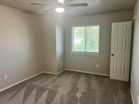 8412 Widgeon Way, Dallas, TX 75249 - empty room featuring carpet, ceiling fan, and a textured ceiling
