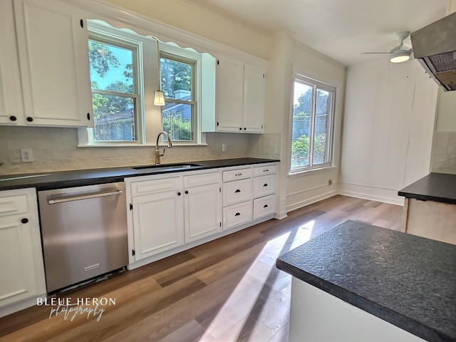 129 Ardmore Ave, Shreveport, LA 71105 - kitchen featuring dishwasher, a sink, dark countertops, and wood finished floors