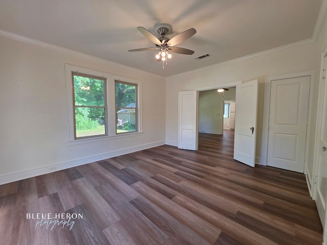 129 Ardmore Ave, Shreveport, LA 71105 - empty room featuring plenty of natural light, dark wood finished floors, ceiling fan, baseboards, and ornamental molding