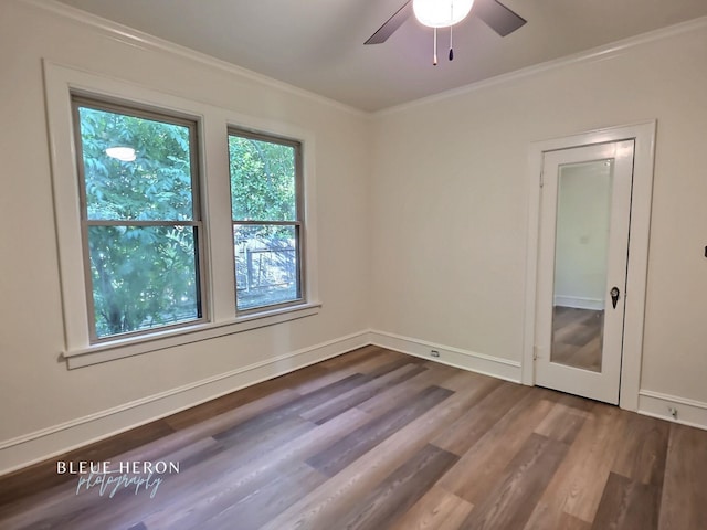 129 Ardmore Ave, Shreveport, LA 71105 - spare room featuring wood finished floors, crown molding, a ceiling fan, and baseboards
