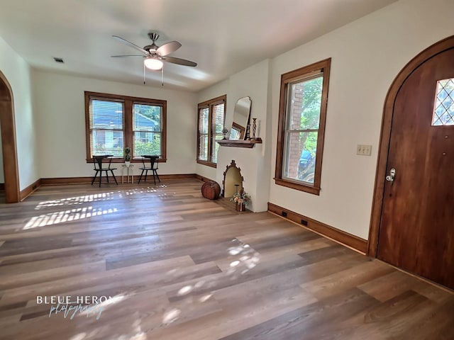 129 Ardmore Ave, Shreveport, LA 71105 - entryway featuring arched walkways, plenty of natural light, and wood finished floors