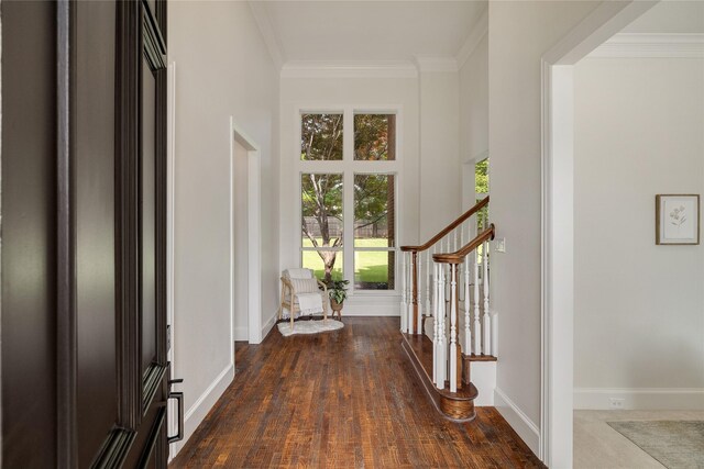 6408 Riverside Dr, Plano, TX 75024 - entrance foyer featuring ornamental molding, stairs, baseboards, and wood finished floors