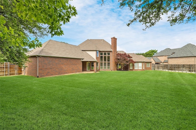 6408 Riverside Dr, Plano, TX 75024 - rear view of property with brick siding, a chimney, and a shingled roof