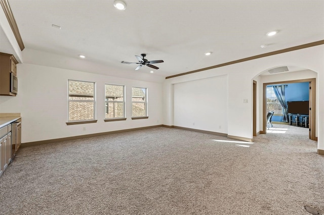13818 Mammoth Cave Ln, Frisco, TX 75035 - unfurnished living room featuring arched walkways, ceiling fan, plenty of natural light, light carpet, and recessed lighting