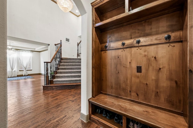 13818 Mammoth Cave Ln, Frisco, TX 75035 - mudroom featuring wood finished floors, baseboards, and a chandelier