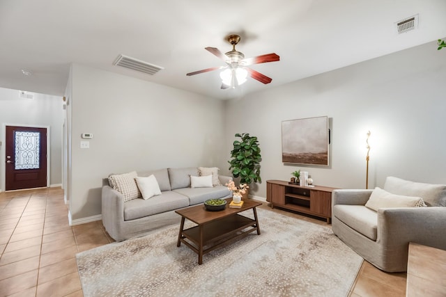 851 Carolina Way, Lantana, TX 76226 - living room featuring light tile patterned floors, a ceiling fan, and baseboards