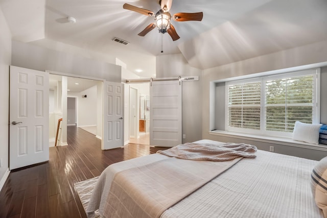 851 Carolina Way, Lantana, TX 76226 - bedroom with a barn door, dark wood finished floors, baseboards, vaulted ceiling, and a ceiling fan