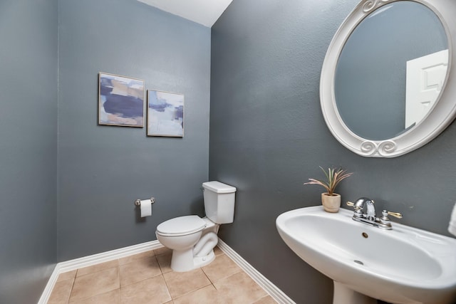 851 Carolina Way, Lantana, TX 76226 - half bathroom featuring a sink, tile patterned flooring, toilet, and baseboards