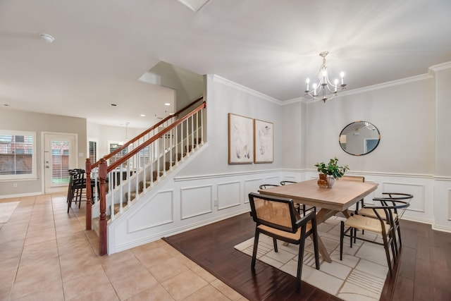 851 Carolina Way, Lantana, TX 76226 - dining area featuring a chandelier, stairway, a decorative wall, ornamental molding, and light tile patterned floors