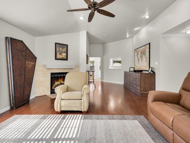 1308 River Birch Ln, Carrollton, TX 75007 - living area featuring a ceiling fan, wood finished floors, a tiled fireplace, baseboards, and recessed lighting