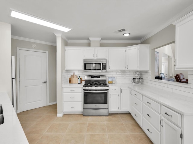 1308 River Birch Ln, Carrollton, TX 75007 - kitchen with stainless steel appliances, ornamental molding, backsplash, light countertops, and white cabinetry