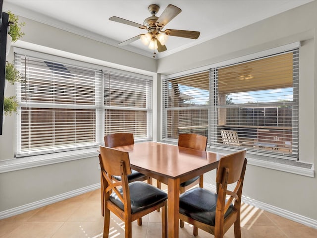 1308 River Birch Ln, Carrollton, TX 75007 - dining space featuring light tile patterned flooring, ceiling fan, baseboards, ornamental molding, and healthy amount of natural light
