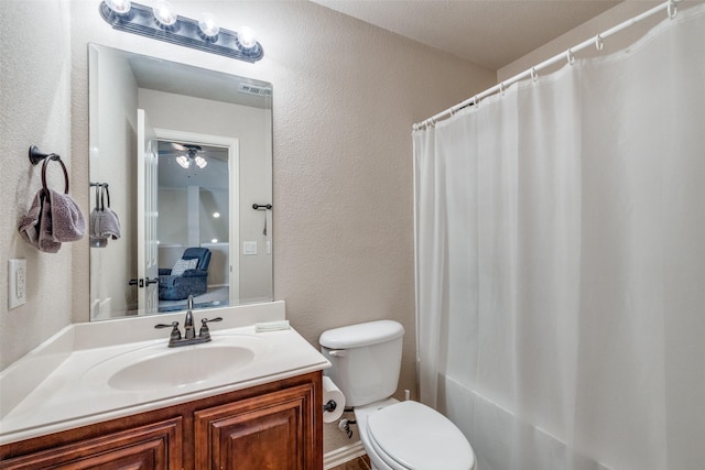 4806 Ashbury Ln, Mansfield, TX 76063 - full bath featuring vanity, toilet, a textured wall, and shower / tub combo