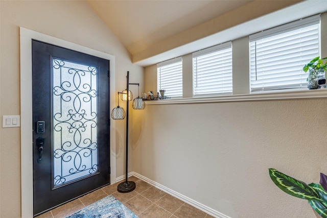4806 Ashbury Ln, Mansfield, TX 76063 - foyer entrance with tile patterned flooring, baseboards, and vaulted ceiling