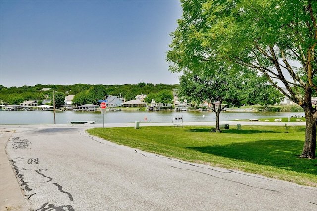 4009 Scenic Way, Granbury, TX 76049 - view of asphalt street with traffic signs and a water view