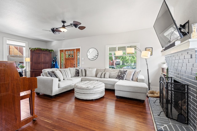 2236 Alston Ave, Fort Worth, TX 76110 - living room with wood finished floors, a brick fireplace, and ceiling fan