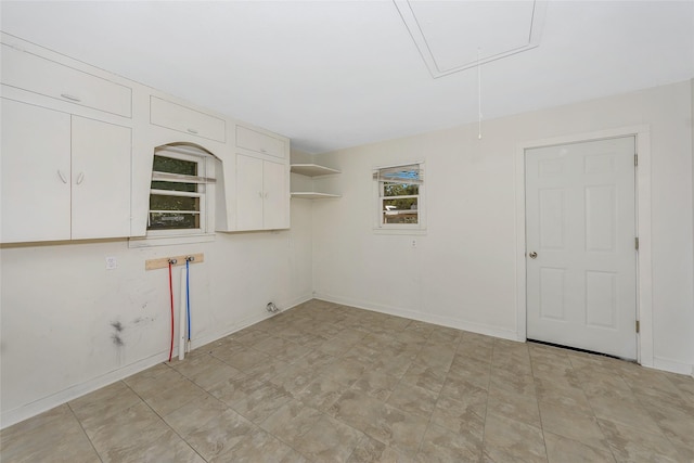 723 Leftys Ct, Possum Kingdom Lake, TX 76449 - empty room with attic access and baseboards