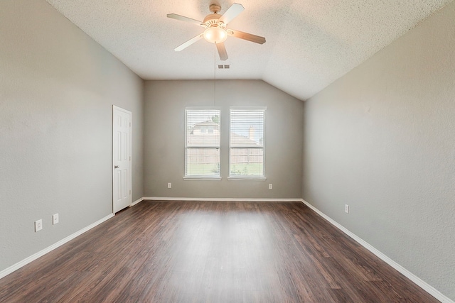 1010 Hanover Dr, Forney, TX 75126 - unfurnished room with ceiling fan, dark wood-type flooring, a textured ceiling, baseboards, and lofted ceiling