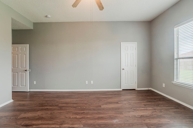 1010 Hanover Dr, Forney, TX 75126 - spare room featuring dark wood-type flooring, ceiling fan, and baseboards