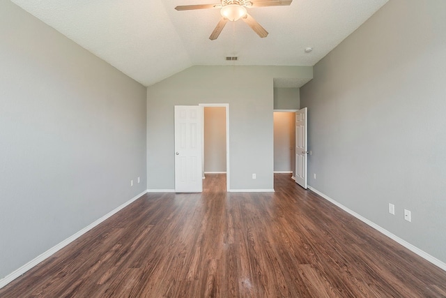 1010 Hanover Dr, Forney, TX 75126 - unfurnished bedroom with dark wood-type flooring, baseboards, vaulted ceiling, and ceiling fan