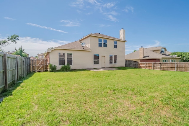 1010 Hanover Dr, Forney, TX 75126 - rear view of house with a chimney and a patio