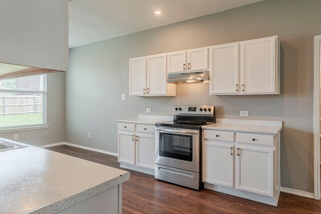 1010 Hanover Dr, Forney, TX 75126 - kitchen with electric stove, under cabinet range hood, dark wood-style flooring, white cabinets, and a textured ceiling