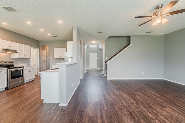 1010 Hanover Dr, Forney, TX 75126 - kitchen featuring electric stove, under cabinet range hood, ceiling fan, open floor plan, and dark wood-style floors