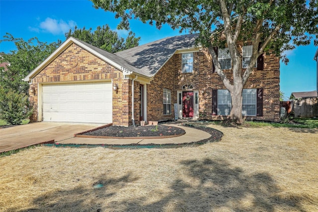 7333 Mesa Verde Trl, Fort Worth, TX 76137 - view of front of home with brick siding, concrete driveway, a garage, and a shingled roof