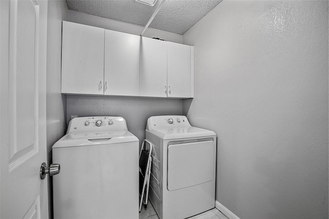 7333 Mesa Verde Trl, Fort Worth, TX 76137 - laundry room featuring cabinet space, washing machine and dryer, a textured ceiling, and light tile patterned floors
