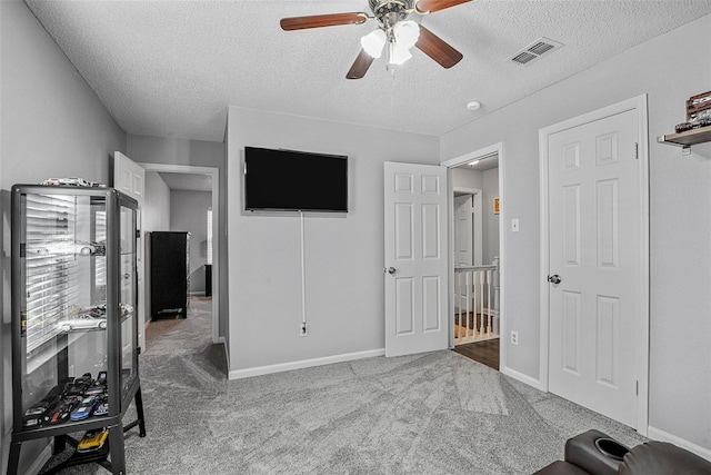 7333 Mesa Verde Trl, Fort Worth, TX 76137 - bedroom featuring a textured ceiling, carpet, a ceiling fan, and baseboards