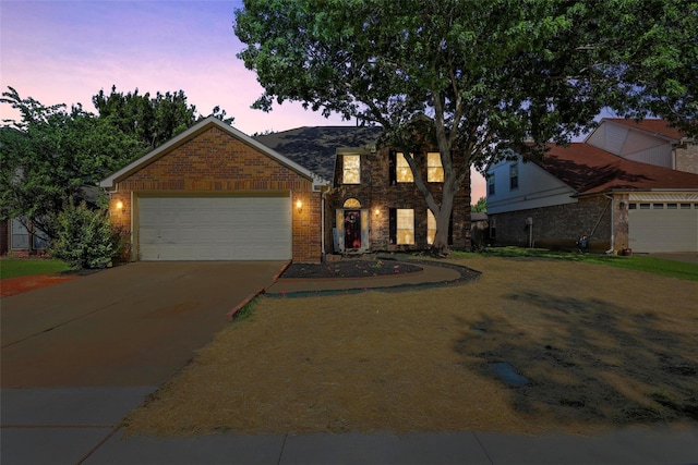7333 Mesa Verde Trl, Fort Worth, TX 76137 - traditional home with concrete driveway, a garage, and brick siding