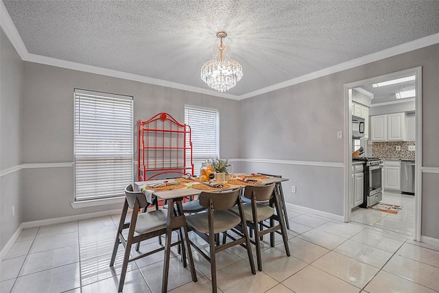 7333 Mesa Verde Trl, Fort Worth, TX 76137 - dining area with a chandelier, a textured ceiling, light tile patterned floors, crown molding, and baseboards