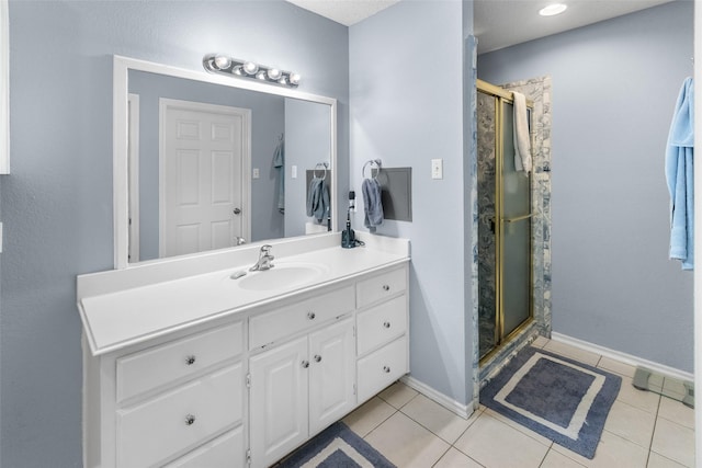 203 Marianne, Sulphur Springs, TX 75482 - bathroom with vanity, a stall shower, baseboards, and tile patterned floors