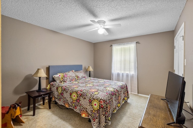 203 Marianne, Sulphur Springs, TX 75482 - bedroom featuring carpet flooring, baseboards, ceiling fan, and a textured ceiling