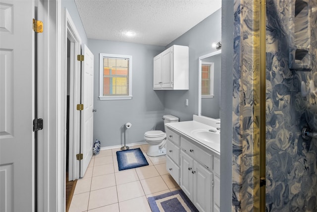 203 Marianne, Sulphur Springs, TX 75482 - full bathroom with a textured ceiling, vanity, tile patterned flooring, baseboards, and toilet