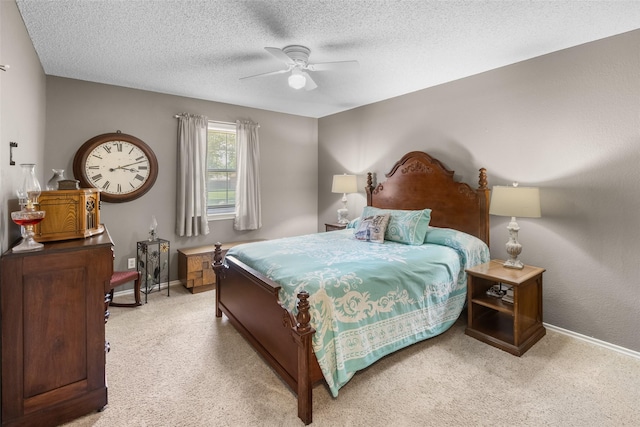 203 Marianne, Sulphur Springs, TX 75482 - bedroom with baseboards, light carpet, a textured ceiling, and a ceiling fan