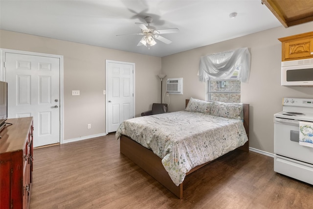 203 Marianne, Sulphur Springs, TX 75482 - bedroom featuring wood finished floors, baseboards, a wall mounted AC, and a ceiling fan