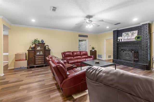 203 Marianne, Sulphur Springs, TX 75482 - living area featuring light wood-type flooring, a ceiling fan, crown molding, recessed lighting, and a textured ceiling