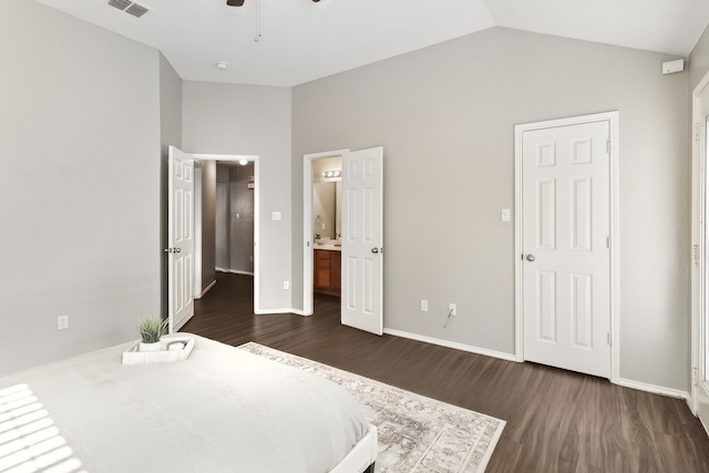 7243 Irish Valley Trl, Fort Worth, TX 76123 - unfurnished bedroom featuring dark wood-type flooring, vaulted ceiling, baseboards, and connected bathroom