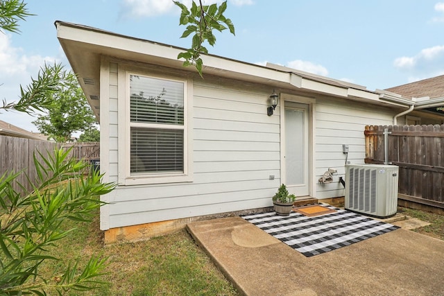 7243 Irish Valley Trl, Fort Worth, TX 76123 - rear view of property with central AC unit, a fenced backyard, and a patio