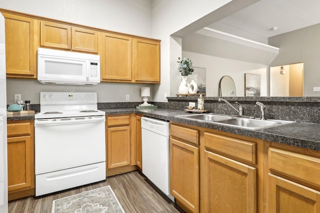 7243 Irish Valley Trl, Fort Worth, TX 76123 - kitchen with white appliances, wood finished floors, a sink, and dark countertops