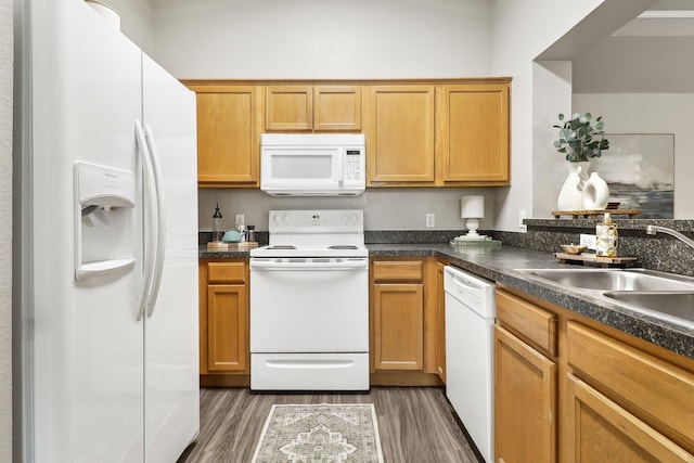 7243 Irish Valley Trl, Fort Worth, TX 76123 - kitchen with white appliances, a sink, dark wood finished floors, and dark countertops
