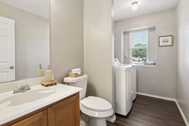 7243 Irish Valley Trl, Fort Worth, TX 76123 - bathroom featuring toilet, wood finished floors, washer and clothes dryer, vanity, and baseboards