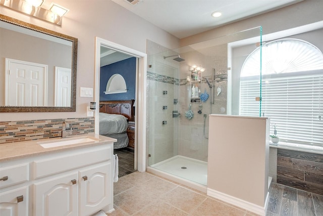5040 Pallas Ct, Fort Worth, TX 76123 - bathroom featuring a shower stall, vanity, connected bathroom, decorative backsplash, and recessed lighting
