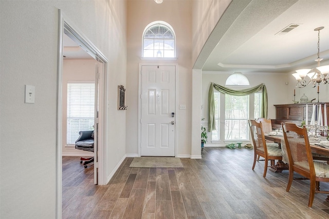 5040 Pallas Ct, Fort Worth, TX 76123 - foyer entrance with a chandelier, healthy amount of natural light, wood finished floors, and baseboards