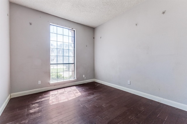 18609 Crownover Ct, Dallas, TX 75252 - unfurnished room with wood-type flooring, a textured ceiling, and baseboards