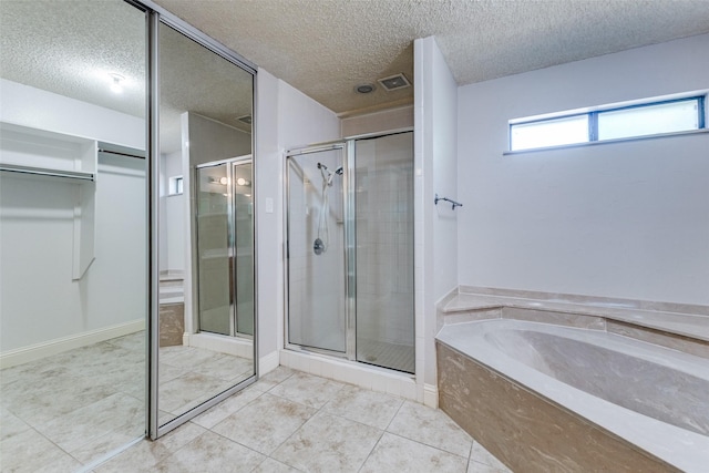 18609 Crownover Ct, Dallas, TX 75252 - full bath featuring a stall shower, a garden tub, a textured ceiling, and tile patterned flooring