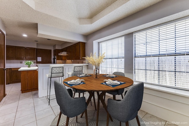 18609 Crownover Ct, Dallas, TX 75252 - dining area with a textured ceiling and light tile patterned floors