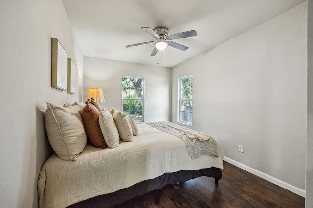1215 Morrell Ave, Dallas, TX 75203 - bedroom with dark wood-type flooring, baseboards, and ceiling fan