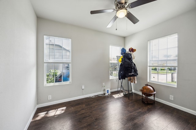 1215 Morrell Ave, Dallas, TX 75203 - empty room featuring healthy amount of natural light, wood finished floors, and baseboards